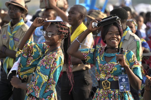 Faithful wait at Ndolo airport where Pope Francis will preside over the Holy Mass in Kinshasa, Congo, Wednesday February 1, 2023. Francis is in Congo and South Sudan for a six-day trip, hoping to bring comfort and encouragement to two countries that have been riven by poverty, conflicts and what he calls a “colonialist mentality” that has exploited Africa for centuries. (Photo by Gregorio Borgia/AP Photo)