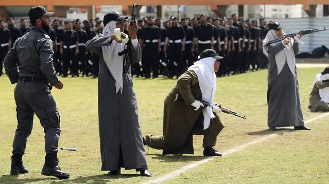 Female members of Palestinian security forces loyal to Hamas take part in a military graduation ceremony in Gaza City, on April 2, 2014. (Photo by Mohammed Salem/Reuters)