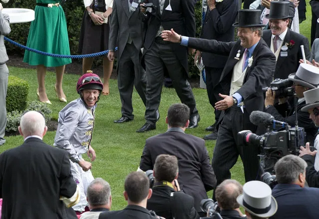 Jockey Frankie Dettorio celebrates after his 50th Royal Ascot win on Osalia in the Sandringham Handicap Stakes on the second day of  Royal Ascot horse racing meet at Ascot, England, Wednesday, June 17, 2015. Royal Ascot is the annual five day horse race meeting that Britain's Queen Elizabeth II attends every day of the event. (AP Photo/Alastair Grant)
