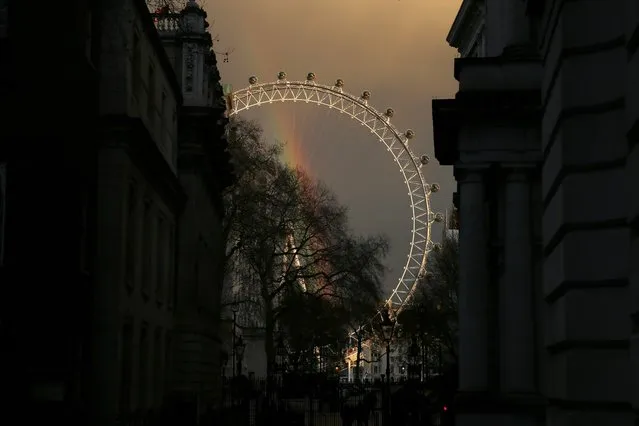 A rainbow is seen through the London Eye in central London, Britain December 8, 2015. (Photo by Stefan Wermuth/Reuters)