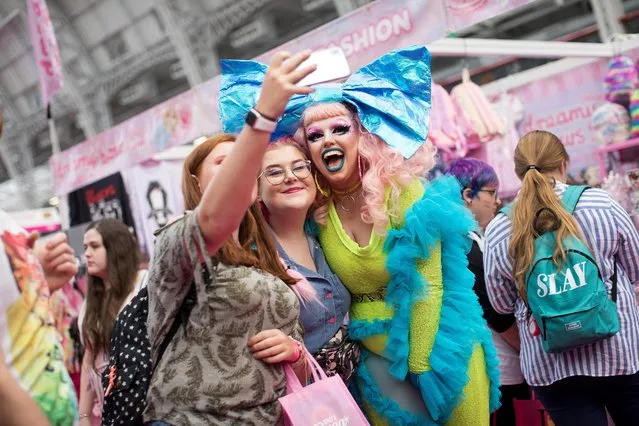 Attendees take a selfie photograph during DragWorld UK 2019 convention at the Olympia in London, Britain, August 18, 2019. (Photo by Simon Dawson/Reuters)