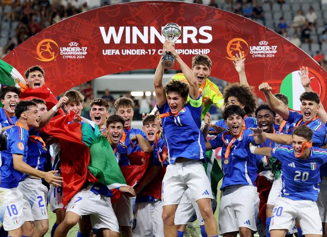 Italy's Mattia Mosconi lifts the trophy as he celebrates with teammates after winning the U17 Euro 2024 after their match against Portugal at Alphamega Stadium, Limassol, in Cyprus on June 5, 2024. (Photo by Yiannis Kourtoglou/Reuters)