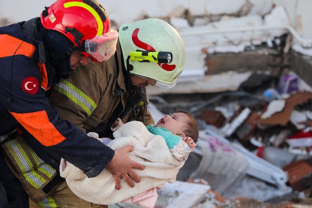 Hulya Yilmaz and her baby Ayse Vera are rescued under the rubble of a collapsed building after 29 hours of 7.7 and 7.6 magnitude earthquakes hit Hatay, Turkiye on February 7, 2023. Early Monday morning, a strong 7.7 earthquake, centered in the Pazarcik district, jolted Kahramanmaras and strongly shook several provinces, including Gaziantep, Sanliurfa, Diyarbakir, Adana, Adiyaman, Malatya, Osmaniye, Hatay, and Kilis. Later, at 13.24 p.m. (1024GMT), a 7.6 magnitude quake centered in Kahramanmaras' Elbistan district struck the region. Turkiye declared 7 days of national mourning after deadly earthquakes in southern provinces. (Photo by AytugCan Sencar/Anadolu Agency via Getty Images)