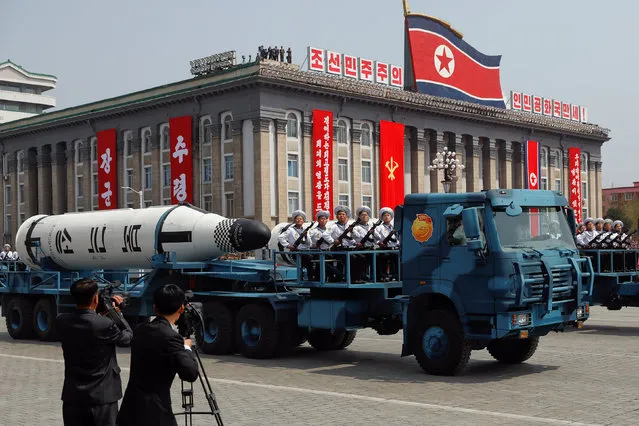 Military vehicles carry missiles with characters reading 'Pukkuksong' during a military parade marking the 105th birth anniversary of country's founding father, Kim Il Sung in Pyongyang, April 15, 2017. (Photo by Damir Sagolj/Reuters)