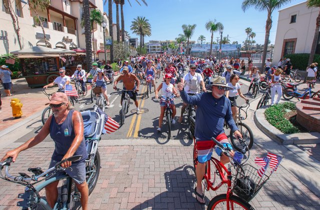 Cyclists participating in the 5th Annual Bicycle Cruise of Huntington Beach finish their ride on Main St on June 29, 2024. The parade of bikes kicks off a week of Fourth of July celebrations culminating in the largest fireworks show west of the Mississippi. (Photo by Ron Lyon/ZUMA Press Wire/Rex Features/Shutterstock)