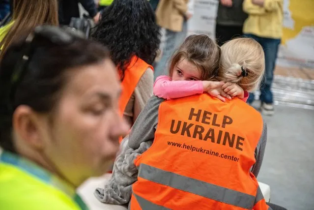 Volunteers work at the Help Ukraine Center in Lublin, southeastern Poland, 02 May 2022. Since February 24, when Russia invaded Ukraine, 3,097,000 people have crossed the Polish-Ukrainian border into Poland, the Polish Border Guard has reported on 02 May morning. (Photo by Wojtek Jargilo/EPA/EFE)