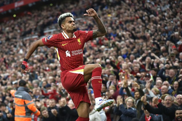 Liverpool's Luis Diaz celebrates after scoring his side's opening goal during the English Premier League soccer match between Liverpool and Brentford at Anfield Stadium, Liverpool, England, Sunday, August 25, 2024. (Photo by Rui Vieira/AP Photo)