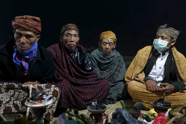 Tenggerese shamans sit during the Kasada Festival at Mount Bromo in Probolinggo, Indonesia's East Java province, August 1, 2015. (Photo by Reuters/Beawiharta)