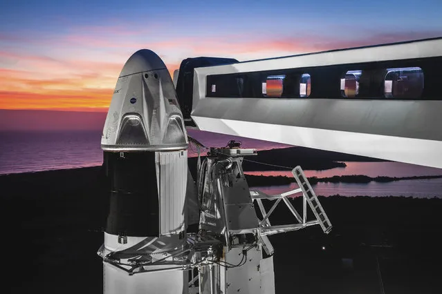This undated photo made available by SpaceX on February 6, 2019 shows the Dragon crew capsule atop a Falcon 9 rocket at the launch pad at Kennedy Space Center in Florida where the Saturn Vs and space shuttles were launched. On Friday, Feb. 22, 2019, NASA and SpaceX announced the approval of an unmanned test flight for the new commercial capsule. (Photo by SpaceX via AP Photo)