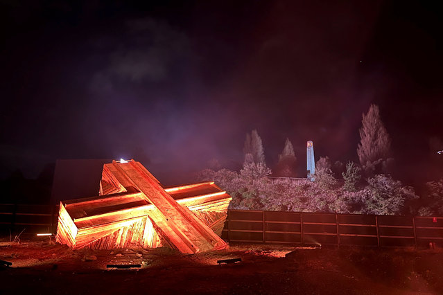 Large wooden cross is displayed at the Dark Mofo festival in Hobart, Tasmania, Australia on June 15, 2023. (Photo by Lewis Jackson/Reuters)