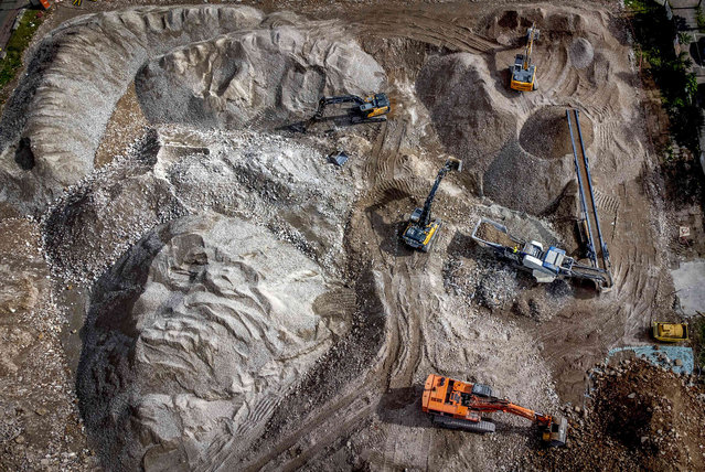 Excavators are pictured at a construction site in the city centre in Frankfurt, Germany, Friday, September 13, 2024. (Photo by Michael Probst/AP Photo)