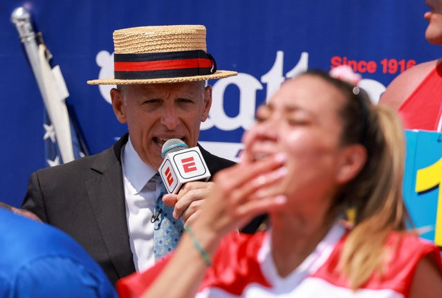 George Shea speaks as World Champion Miki Sudo competes during the 2023 Nathan's Famous Fourth of July International Hot Dog Eating Contest at Coney Island in New York City, U.S., July 4, 2023. (Photo by Amr Alfiky/Reuters)