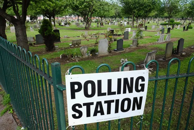 A polling station sign is attached to railings next to a cemetery in Redcar as voters head to the polls to cast their vote on the EU Referendum on June 23, 2016 in Redcar, United Kingdom. (Photo by Ian Forsyth/Getty Images)