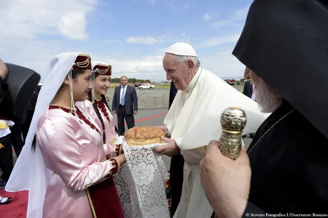 Pope Francis attends a welcoming ceremony at the airport in Gyumri, Armenia, June 25, 2016. (Photo by Osservatore Romano/Reuters)