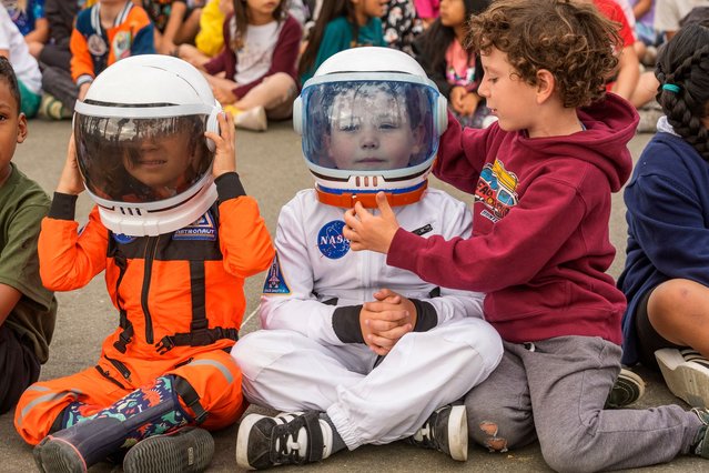 Santiago STEAM Magnet Elementary School students attend a ceremony to plant a small Giant Sequoia tree from NASA's Artemis I Mission's tree seeds that traveled around the moon twice, after the school was honored in the spring of 2024 to become NASA Moon Tree Stewards in Lake Forest, Calif., on Monday, October 14, 2024. (Photo by Damian Dovarganes/AP Photo)