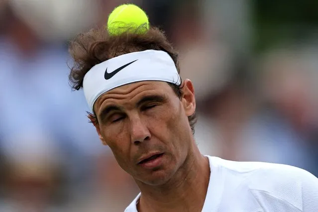 Spain's Rafael Nadal heads the ball as he plays against Canada's Felix Auger-Aliassime during their men's exhibition singles match at The Giorgio Armani Tennis Classic tournament at the Hurlingham Club in London on June 24, 2022. (Photo by Adrian Dennis/AFP Photo)