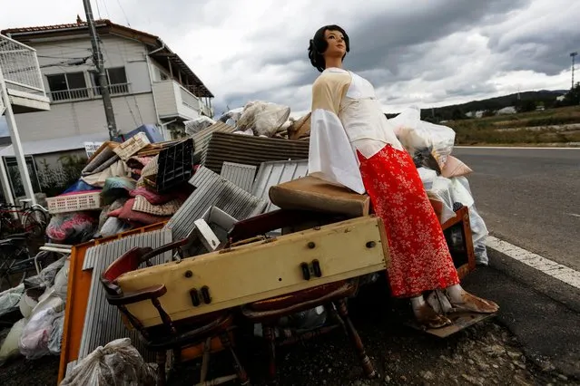 A mannequin lies on top of furniture and belongings near flooded homes, in the aftermath of Typhoon Hagibis, in Koriyama, Fukushima prefecture, Japan on October 15, 2019. (Photo by Soe Zeya Tun/Reuters)