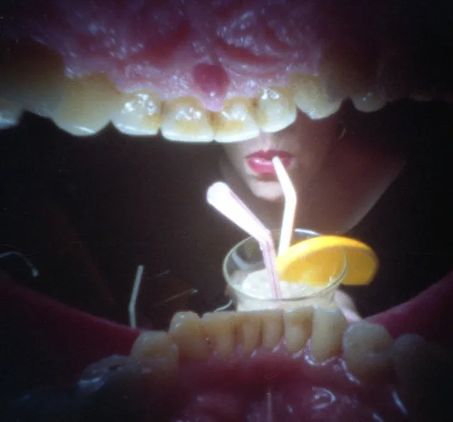Photographer uses pinhole camera in his mouth to capture photos around the world. The 52-year-old Justin Quinnell, who lives in Bristol, is known for his eye-catching photographs taken from a unique angle – right inside his mouth. (Photo by Justin Quinnell/Rex Features)