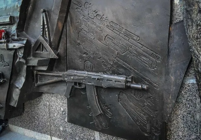 Detail of the high relief featuring a blueprint of the Sturmgewehr StG 44 rifle at the base of a newly unveiled monument to Mikhail Kalashnikov, the inventor of the AK-47 assault rifle, by Salavat Shcherbakov in central Moscow, Russia on September 22, 2017. The Russian Military Historical Society, which commissioned the monument, has announced that the high relief is to be removed since the AK-47 is not related to the German rifle. (Photo by Mikhail Pochuyev/TASS via Getty Images)