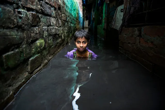 Winner of the Built Environment category: Raju Ghosh with “Struggle”. Ghosh’s photograph shows a small boy struggling through an alleyway flooded with monsoon rain in a West Bengal slum. Inadequate infrastructure presents constant challenge for the slum dwellers. (Photo by Raju Ghosh/2017 Ciwem environmental photographer of the year)