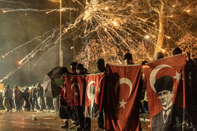 Protesters carry flags as they try to march to Taksim Square from the Istanbul Municipality headquarters during a protest against the detention of Istanbul Mayor Ekrem Imamoglu in Istanbul, Turkey, 23 March 2025. (Photo by Erdem Sahin/EPA/EFE)