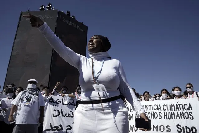Protesters, wearing white in support of political prisoners as well as human rights defenders and environmental activists, participate in a demonstration at the COP27 U.N. Climate Summit, Thursday, November 10, 2022, in Sharm el-Sheikh, Egypt. (Photo by Nariman El-Mofty/AP Photo)