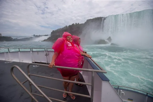 Nancy Gagnon and Johanne Gagnon ride the Canadian tourist boat Hornblower, limited under Ontario's rules to just six passengers amid the spread of the coronavirus disease (COVID-19), in Niagara Falls, Ontario, Canada on July 21, 2020. (Photo by Carlos Osorio/Reuters)