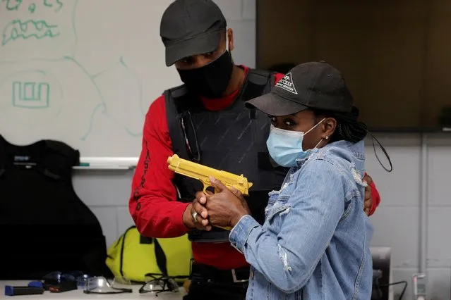 New York's Hudson Valley Nubian Gun Club founder Damon Finch teaches a safety class at a shooting range in Monroe, New York, July 30, 2020. The insecurity brought by the COVID-19 lockdowns combined with anger following the police killing of George Floyd has lead to a higher levels of anxiety, fear and gun ownership, especially among African Americans. (Photo by Brendan McDermid/Reuters)