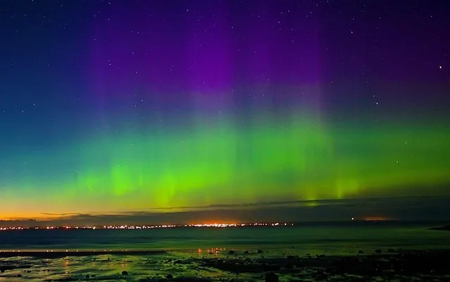 The photographer, a former search-and-rescue winchman for the coastguard, took this picture of the northern lights over Stornoway, UK on September 6, 2022. (Photo by Chris Murray/The Times)