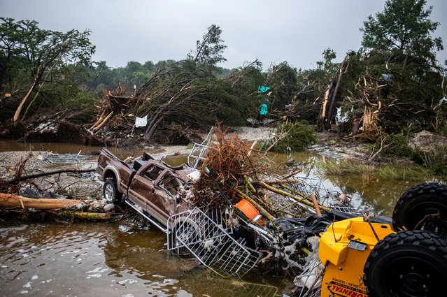 A pickup truck sits damaged after deadly flooding in Kerrville, Texas, on July 5, 2025. (Photo by Sergio Flores/Reuters)