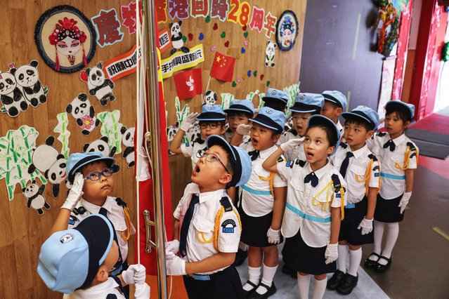 A kindergarten students’ flag-raising team participates in a flag-raising ceremony at a school, ahead of the 28th anniversary of Hong Kong's handover to China from Britain, in Hong Kong, China, on June 30, 2025. (Photo by Tyrone Siu/Reuters)