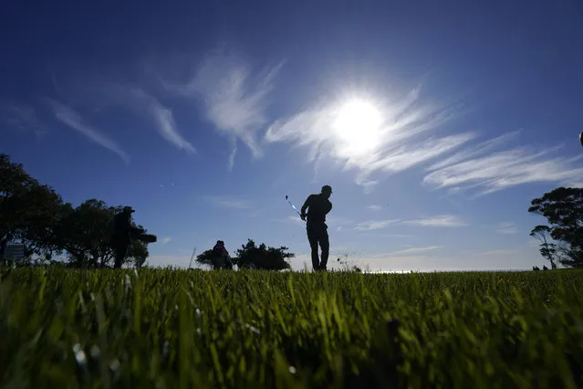 Brent Grant hits his second shot on the 14th hole of the North Course at Torrey Pines during the first round of the Farmers Insurance Open golf tournament, Wednesday, January 25, 2023, in San Diego. (Photo by Gregory Bull/AP Photo)