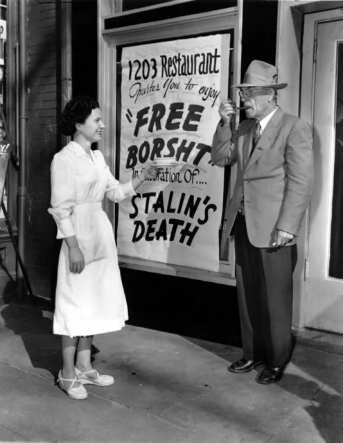 Waitress Eileen Keenan, of Ballinrobi, Ireland, gives a sample of Borsht, a red beet Russian soup, to E.C. Carpenter of Cabin John, Md., outside 1203 Restaurant in Washignton, D.C., on March 6, 1953. The sign outside the restaurant advertises the free Borsht in celebration of Stalin's death. (Photo by AP Photo)