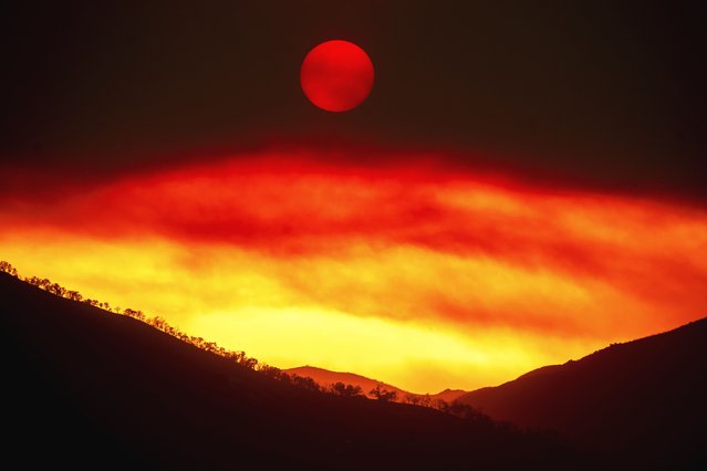 Smoke from the Gifford Fire fills the sky as the sun sets over Los Padres National Forest, Calif., August 4, 2025. (Photo by Noah Berger/AP Photo)