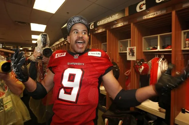 Calgary Stampeders' Jon Cornish celebrates in the locker room after the Stampeders defeated the Hamilton Tiger Cats in the CFL's 102nd Grey Cup football championship in Vancouver, British Columbia, November 30, 2014. (Photo by Todd Korol/Reuters)
