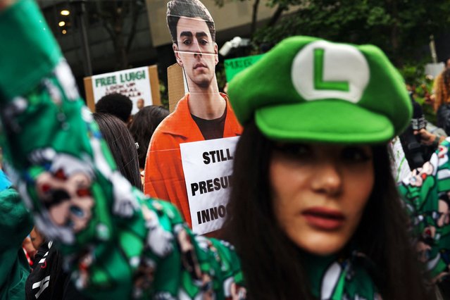People rally in support of Luigi Mangione, the suspect in the killing of UnitedHealthcare chief executive Brian Thompson, on the day of his appearance at Manhattan Supreme Court facing New York State murder and terrorism charges in New York City, U.S., September 16, 2025. (Photo by Shannon Stapleton/Reuters)