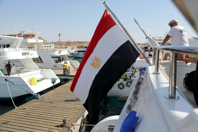 An Egyptian flag is seen on a yacht for an excursion at a small port of the Red Sea resort of Sharm el-Sheikh, November 7, 2015. (Photo by Asmaa Waguih/Reuters)