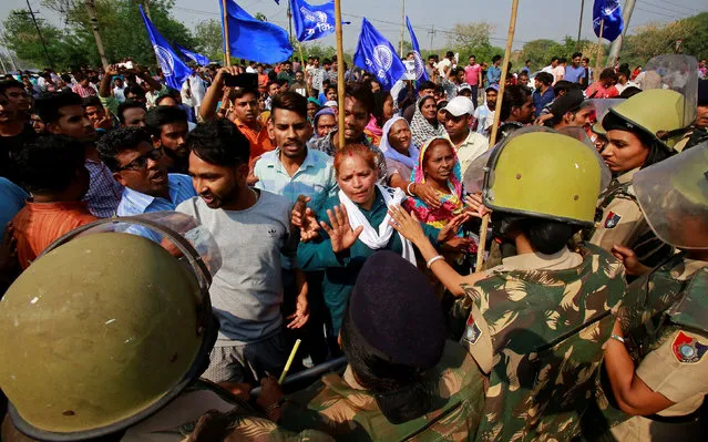 Police try to stop people belonging to the Dalit community as they take part in a protest during a nationwide strike called by Dalit organisations, in Chandigarh, India, April 2, 2018. (Photo by Ajay Verma/Reuters)