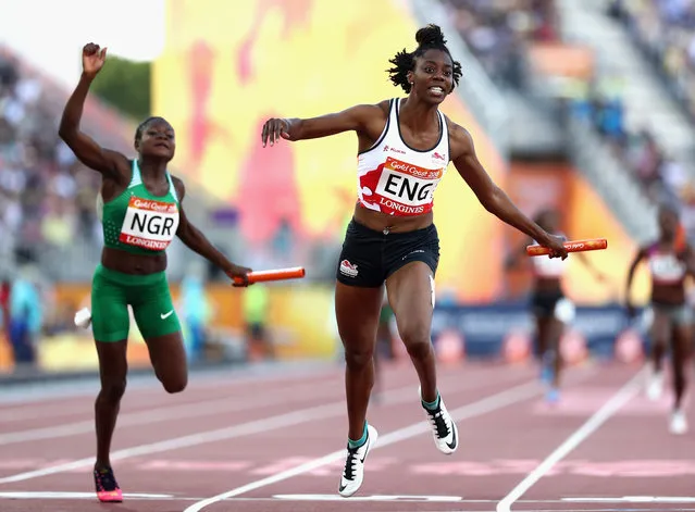 Lorraine Ugen of England crosses to the line to win gold ahead of Rosemary Chukwuma of Nigeria in the Women's 4x100 metres relay final during athletics on day 10 of the Gold Coast 2018 Commonwealth Games at Carrara Stadium on April 14, 2018 on the Gold Coast, Australia. (Photo by Mark Metcalfe/Getty Images)