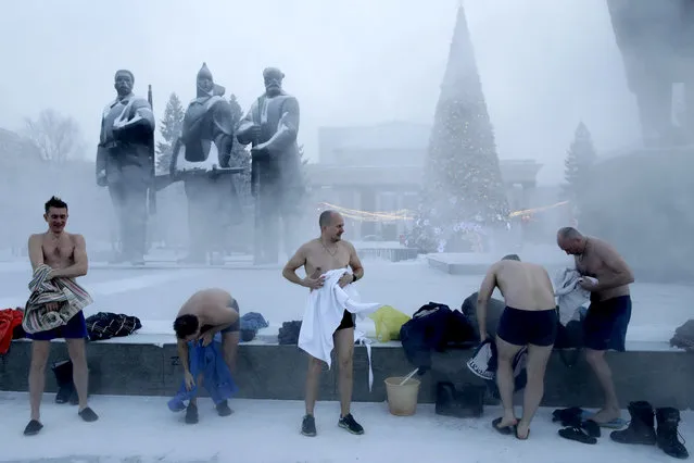 Members of a cold training club after cold water dousing in Lenina Square in Novosibirsk, Russia on December 27, 2020. (Photo by Kirill Kukhmar/TASS)