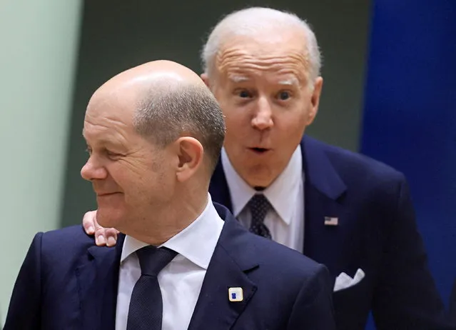 U.S. President Joe Biden speaks to German Chancellor Olaf Scholz during a European Union leaders summit amid Russia's invasion of Ukraine, at the EU headquarters in Brussels, Belgium on March 24, 2022. (Photo by Wolfgang Rattay/Reuters)