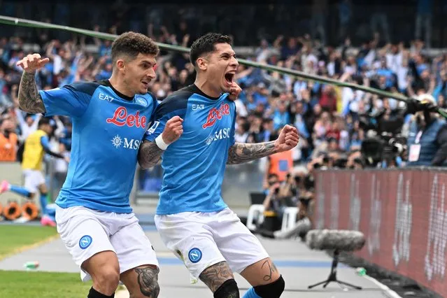 Napoli's Uruguayan defender Mathias Olivera (C) celebrates with Napoli's Italian defender Giovanni Di Lorenzo after opening the scoring during the Italian Serie A football match between Napoli and Salernitana on April 30, 2023 at the Diego-Maradona stadium in Naples. Naples braces for its potential first Scudetto championship win in 33 years. With a 17 point lead at the top of Serie A, southern Italy's biggest club is anticipating its victory in the Scudetto for the first time since 1990. (Photo by Andreas Solaro/AFP Photo)