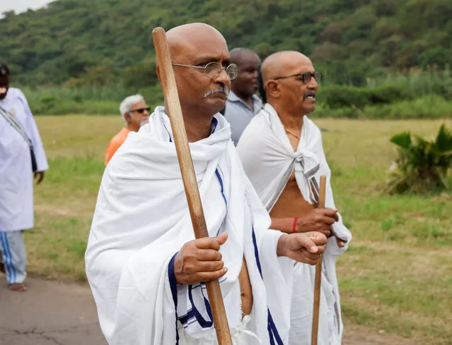 Men dressed as Mahatma Gandhi participate in the annual Salt March in Durban, South Africa on May 7, 2023. (Photo by Rogan Ward/Reuters)