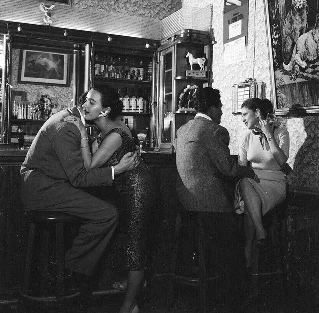 1956:  Clients getting acquainted with two prostitutes at a bar in Guatemala City, capital of Guatemala.  (Photo by Evans/Three Lions/Getty Images)