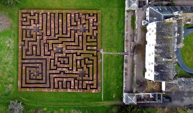 People walk in the Traquair maze, situated in the grounds on Traquair House, in Traquair, Innerleithen, Scotland, Britain on April 28, 2023. (Photo by Lee Smith/Reuters)