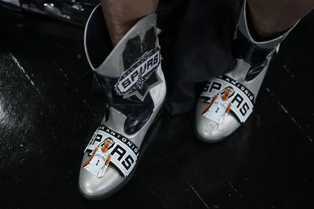 Images of Victor Wembanyama are seen on the cowboy boots of fan Sovia Lauriano as she arrives to watch the NBA basketball draft at the AT&T Center in San Antonio, Thursday, June 22, 2023. San Antonio had. (Photo by Eric Gay/AP Photo)