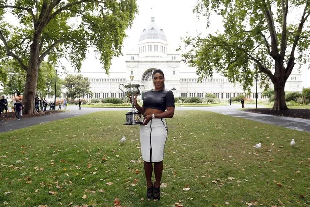 Serena Williams of the U.S. poses with the Daphne Akhurst Memorial Cup after winning the women's singles final match at the 2015 Australian Open tennis tournament during a photo call at Melbourne's Royal Exhibition Building February 1, 2015. (Photo by Issei Kato/Reuters)