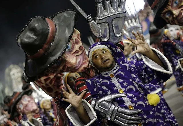 A reveller from Tom Maior Samba School takes part in a carnival at Anhembi Sambadrome in Sao Paulo February 14, 2015. (Photo by Nacho Doce/Reuters)