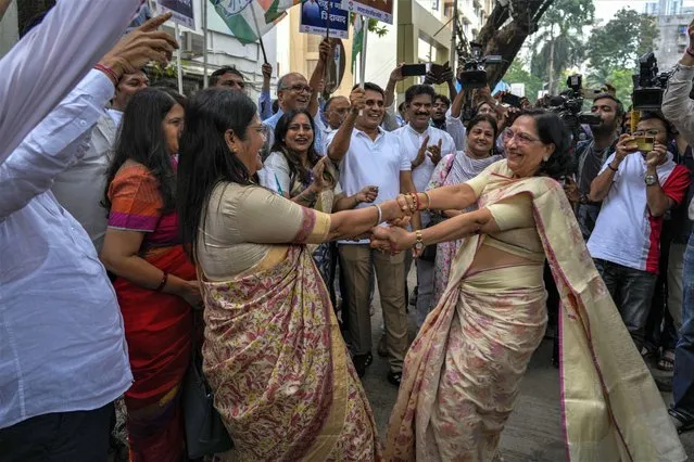 India's opposition Congress party workers celebrate the reinstatement of their leader Rahul Gandhi as a lawmaker in Mumbai, India, Monday, August 7, 2023. India’s Parliament on Monday reinstated Gandhi as a lawmaker three days after the country’s top court halted his criminal defamation conviction for mocking the prime minister’s surname. (Photo by Rafiq Maqbool/AP Photo)