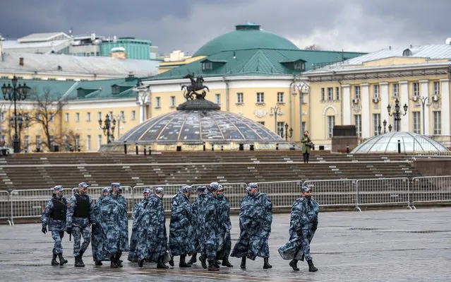 Russian policemen walk on Manezhnaya Square in preparation for a possible opposition rally and prevention of riots in Moscow, Russia, 21 April 2021. Unauthorized rallies in support of Alexei Navalny are expected to be held throughout Russia. Russian opposition leader Alexei Navalny has been transferred from the penal colony No. 2 (IK-2) in Pokrov, Vladimir region, to the regional prison hospital in IK-3 in Vladimir for receiving vitamin therapy. The decision was taken amid Navalny's hunger strike and announced by his team members fearing for his life. (Photo by Yuri Kochetkov/EPA/EFE)